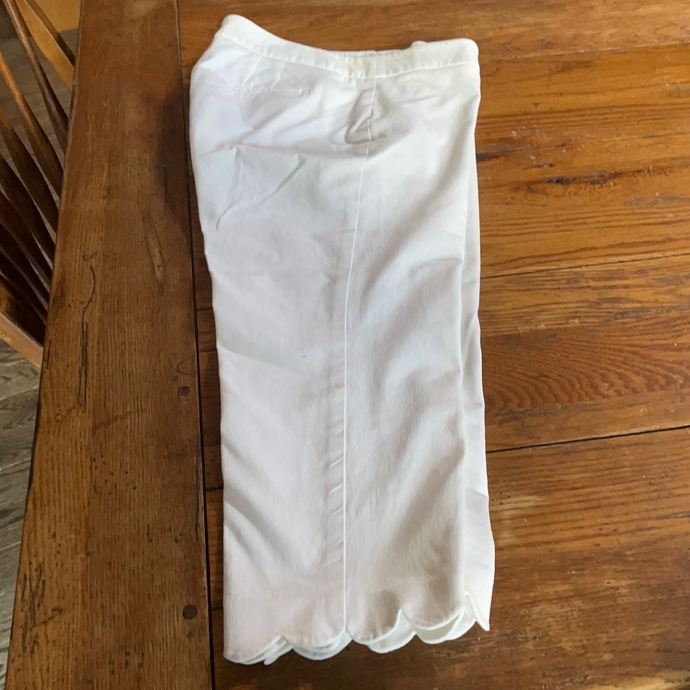 White six petite Capri pants with scallop bottoms.
